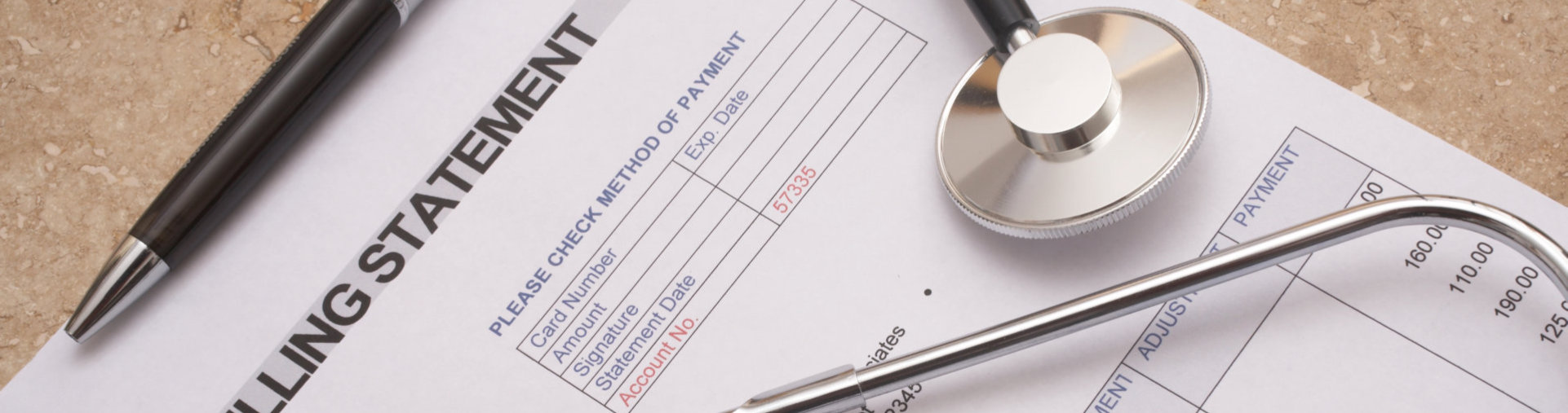 paper in the table with ballpen and stethoscope