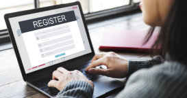 woman registering using laptop