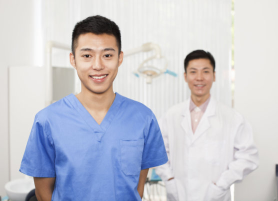 Smiling dental assistant in clinic