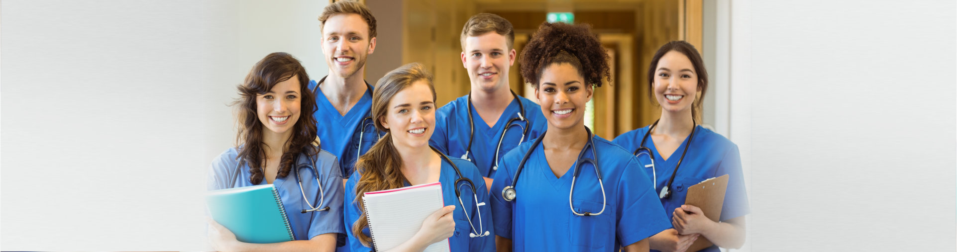 Medical students smiling at the camera at the university